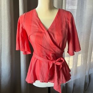 Loft peplum and flutter sleeve coral top
